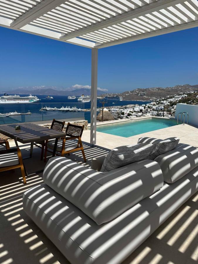terraza con pisicna y sofa Proyecto Hotel Ocean Inn, Mykonos